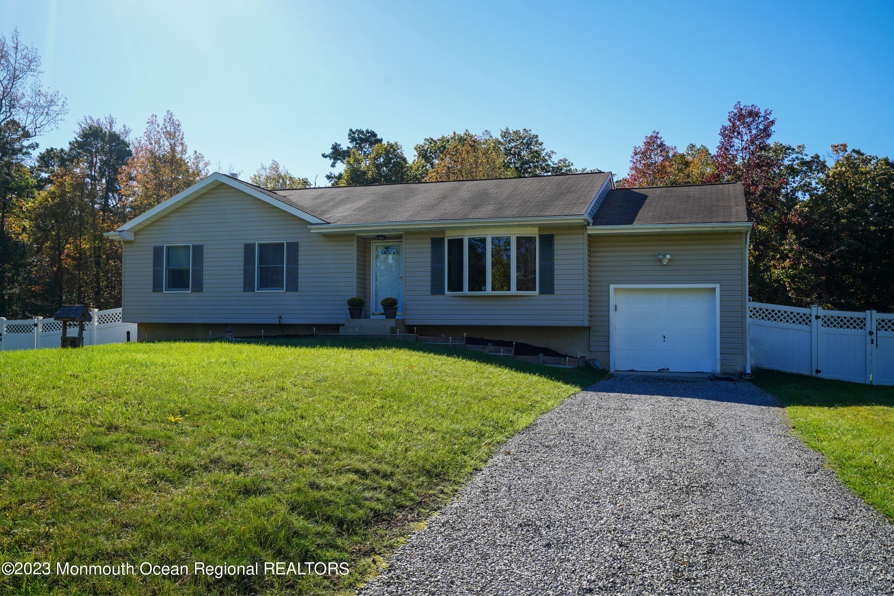 222 Leesville Road Jackson, NJ 08527 - Photo 4 of 61 a front view of a house with a garden and yard