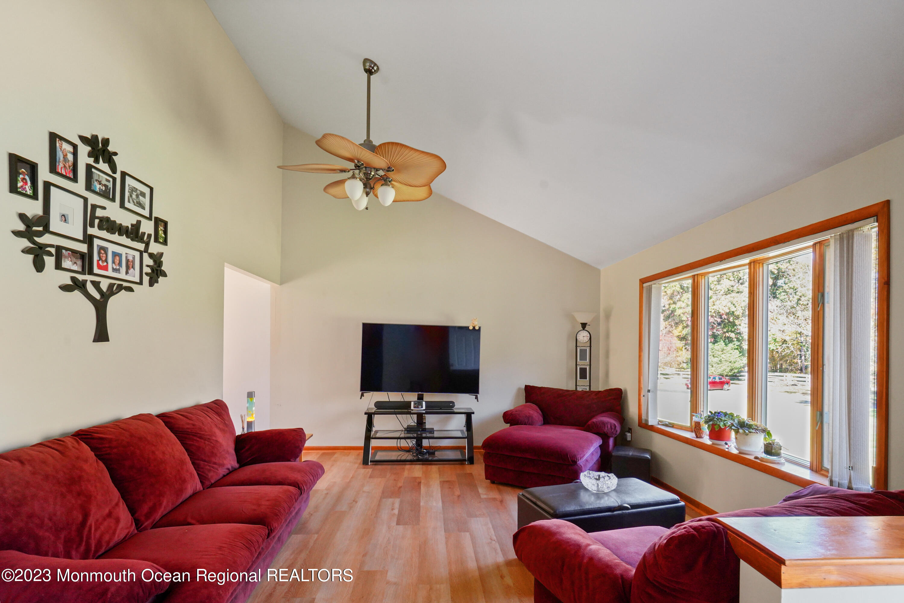 222 Leesville Road Jackson, NJ 08527 - Photo 9 of 61 a living room with furniture a flat screen tv and a large window