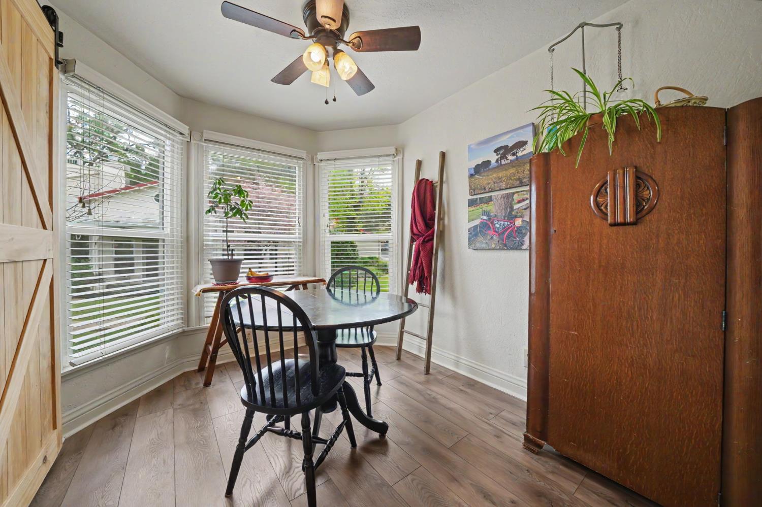 519 Clinton Road Jackson, CA 95642 - Photo 14 of 80 a view of a dining room with furniture window and wooden floor