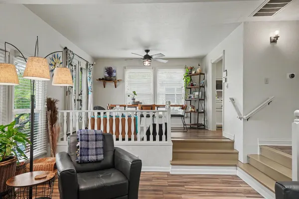 a bedroom with a bed and ceiling fan