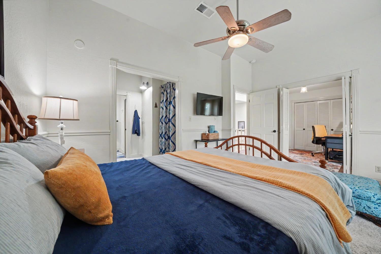 519 Clinton Road Jackson, CA 95642 - Photo 47 of 80 a bedroom with a bed and ceiling fan