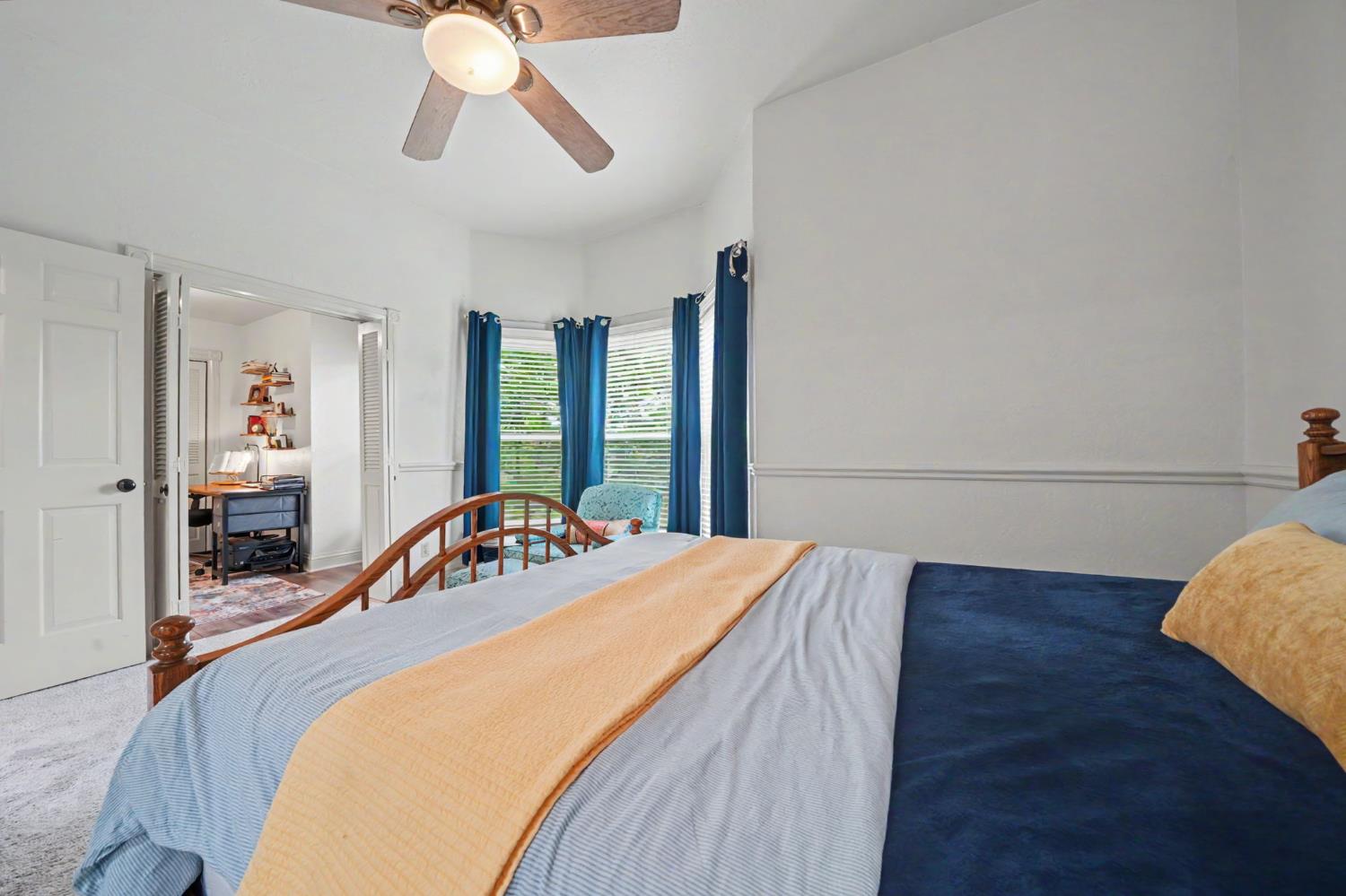 519 Clinton Road Jackson, CA 95642 - Photo 49 of 80 a bedroom with a bed and a chandelier