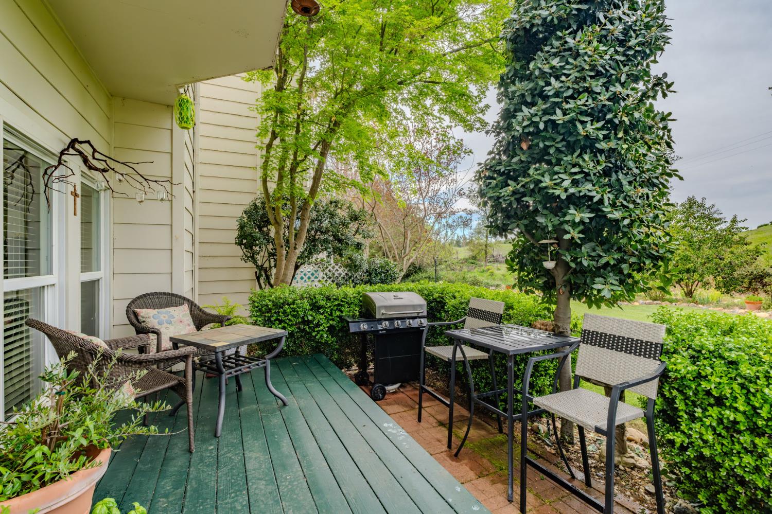 519 Clinton Road Jackson, CA 95642 - Photo 57 of 80 a balcony with wooden floor table and chairs