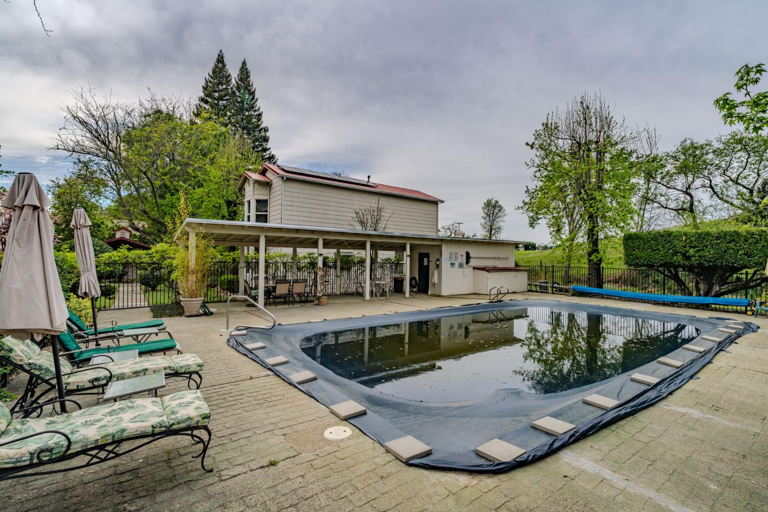 519 Clinton Road Jackson, CA 95642 - Photo 79 of 80 a view of a swimming pool with a patio