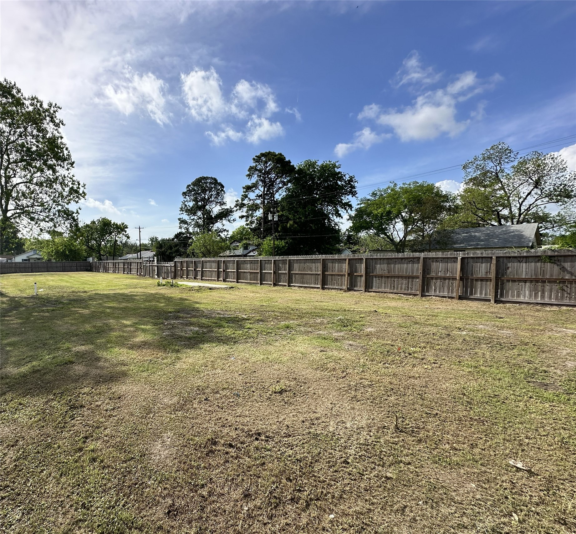 201 South 5th Street Highlands, TX 77562 - Photo 5 of 6 a view of a green yard