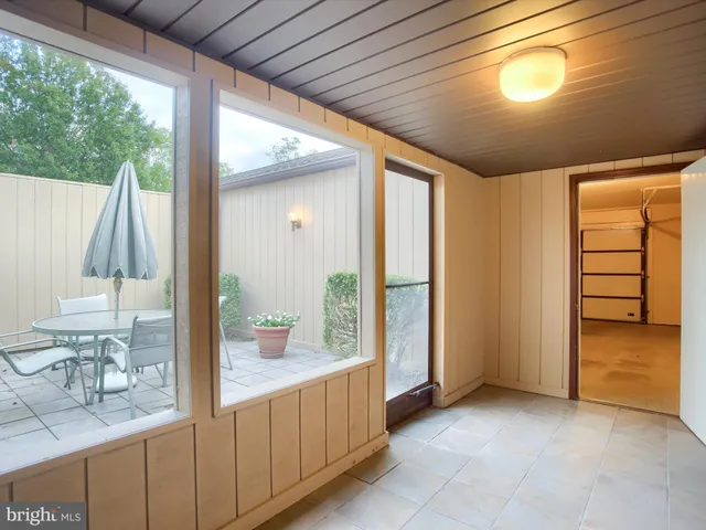 a bathroom with a double vanity sink and a large mirror