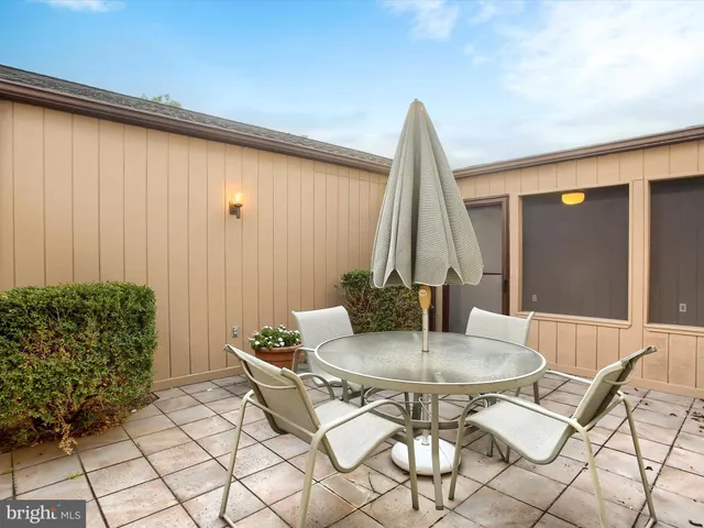a dining room with table and chairs