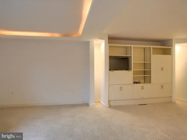 a view of white cabinet with a empty space