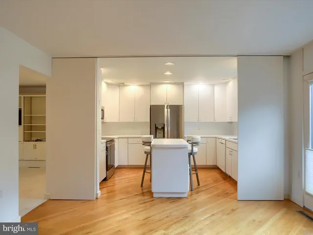 a kitchen with a sink and a refrigerator