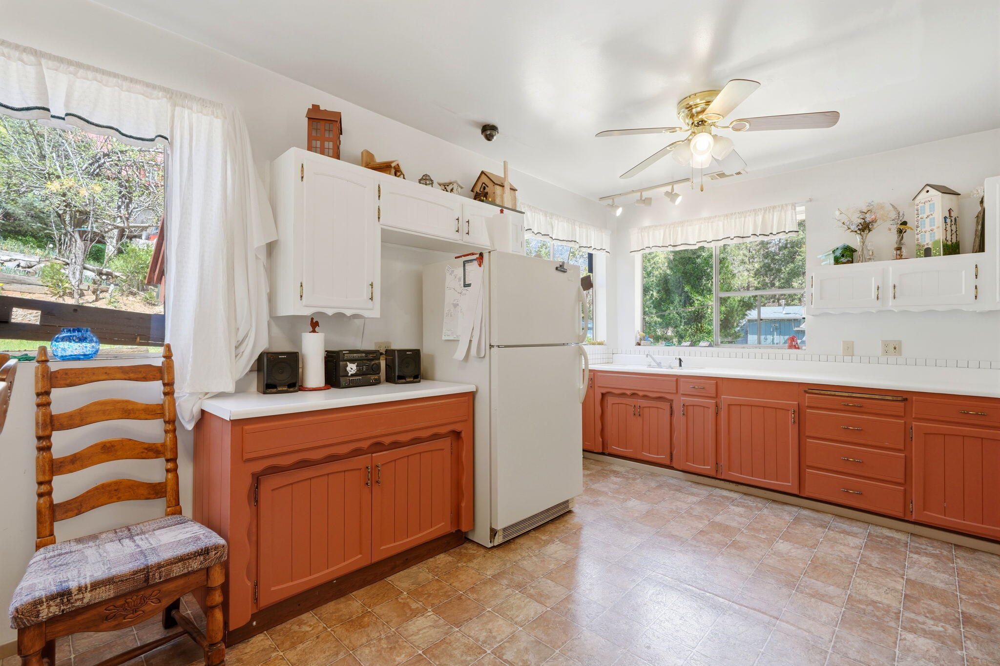 697 Loop Drive Springville, CA 93265 - Photo 19 of 55 a kitchen with white cabinets and white appliances