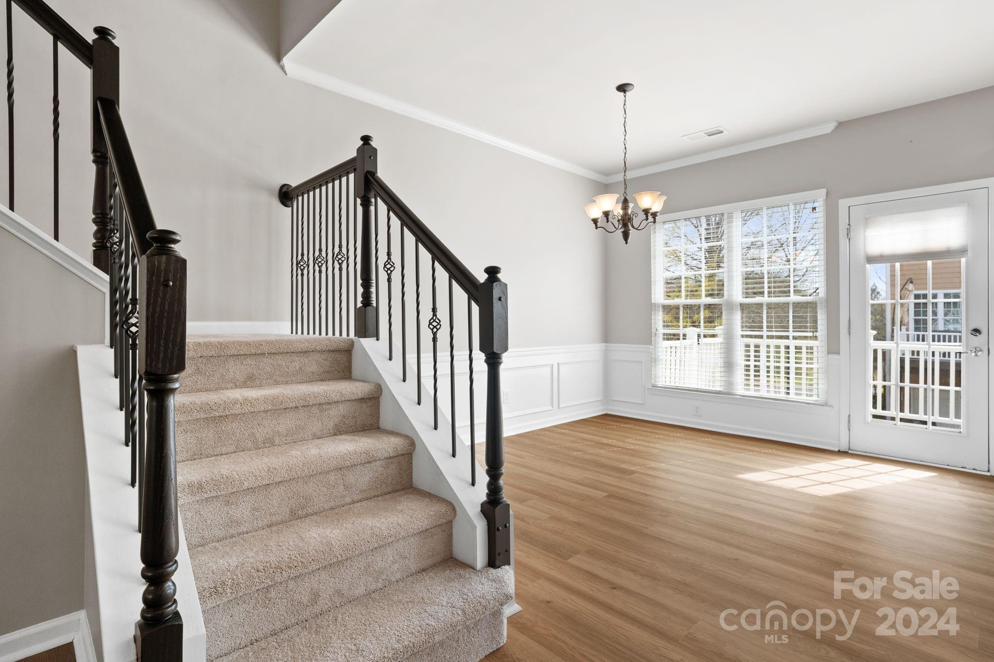 926 Lyndley Drive Fort Mill, SC 29708 - Photo 11 of 36 a view of an entryway with wooden floor and stairs