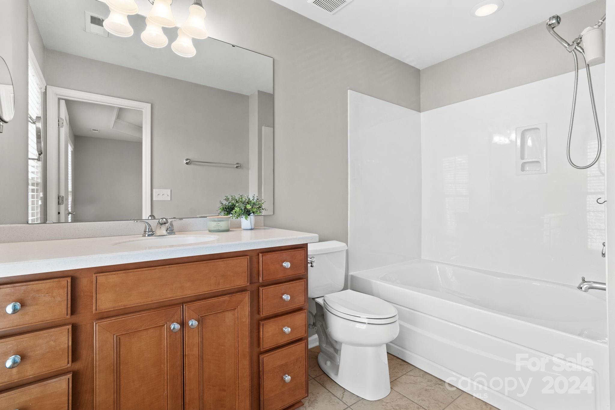 926 Lyndley Drive Fort Mill, SC 29708 - Photo 25 of 36 a bathroom with a sink a toilet and shower