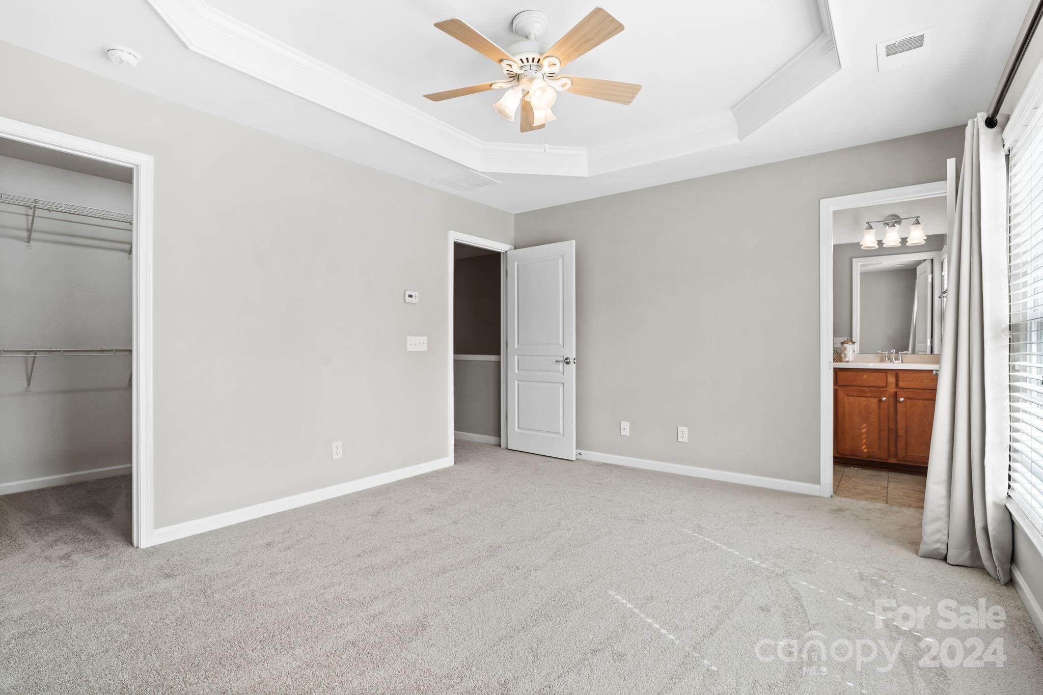 926 Lyndley Drive Fort Mill, SC 29708 - Photo 29 of 36 an empty room with closet and a ceiling fan