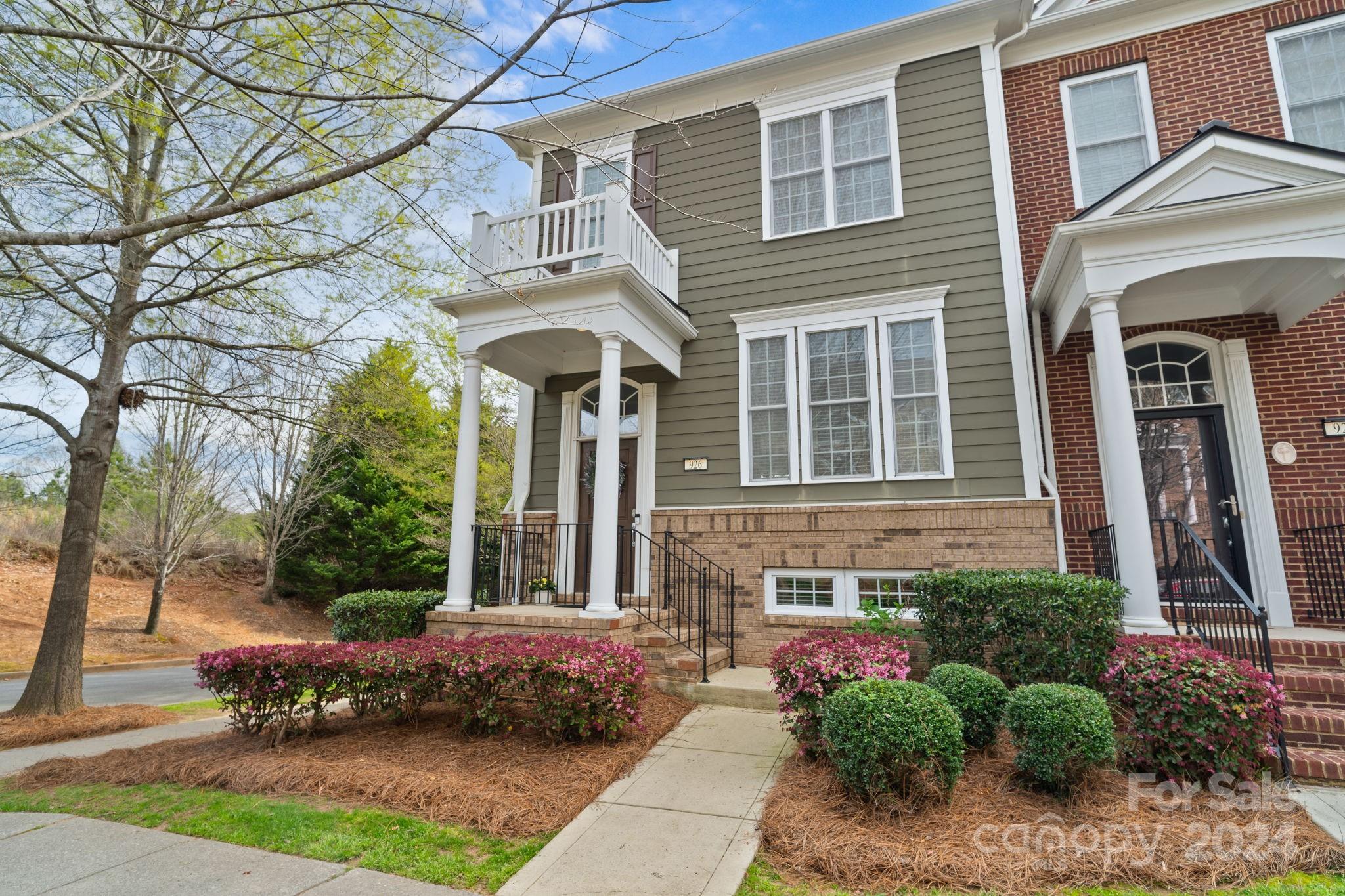 926 Lyndley Drive Fort Mill, SC 29708 - Photo 3 of 36 a front view of a house with a garden