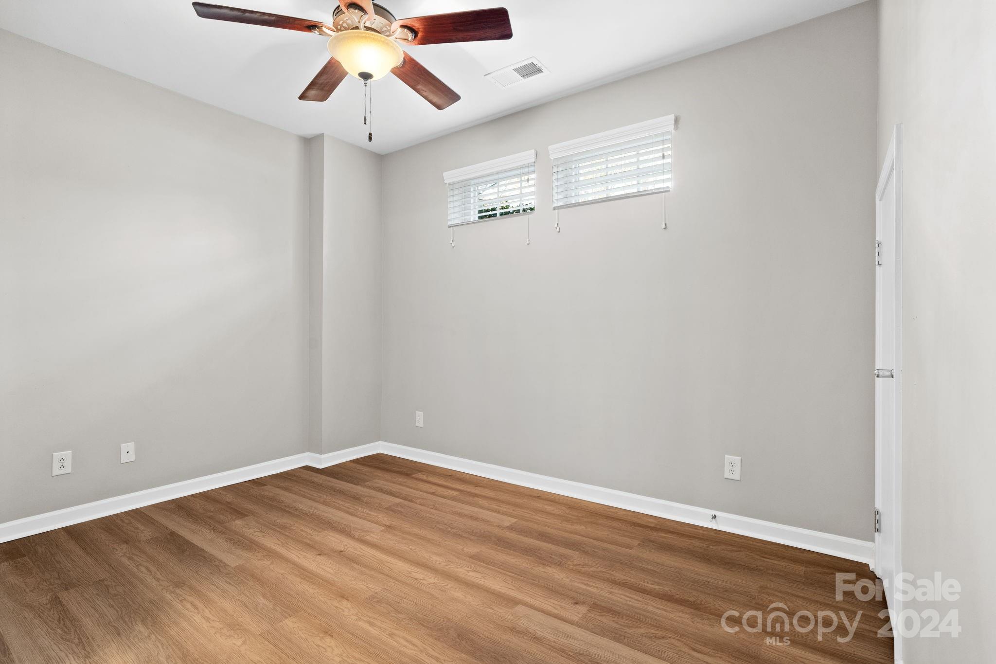 926 Lyndley Drive Fort Mill, SC 29708 - Photo 33 of 36 a view of an empty room with wooden floor