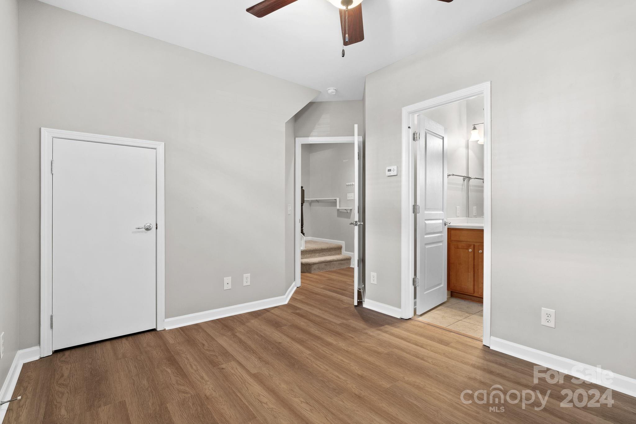 926 Lyndley Drive Fort Mill, SC 29708 - Photo 34 of 36 an empty room with wooden floor and windows