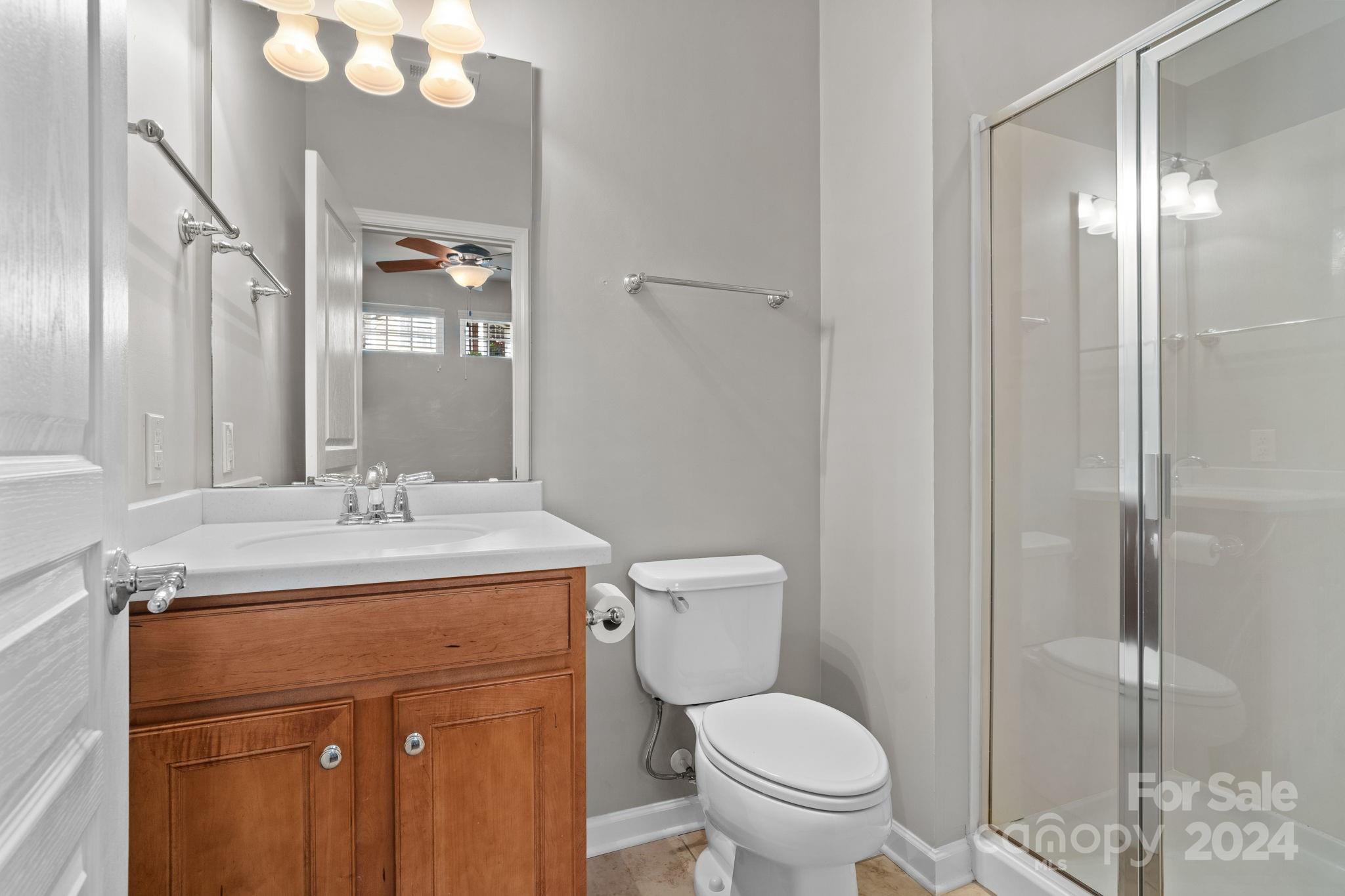 926 Lyndley Drive Fort Mill, SC 29708 - Photo 35 of 36 a bathroom with a granite countertop sink toilet and shower