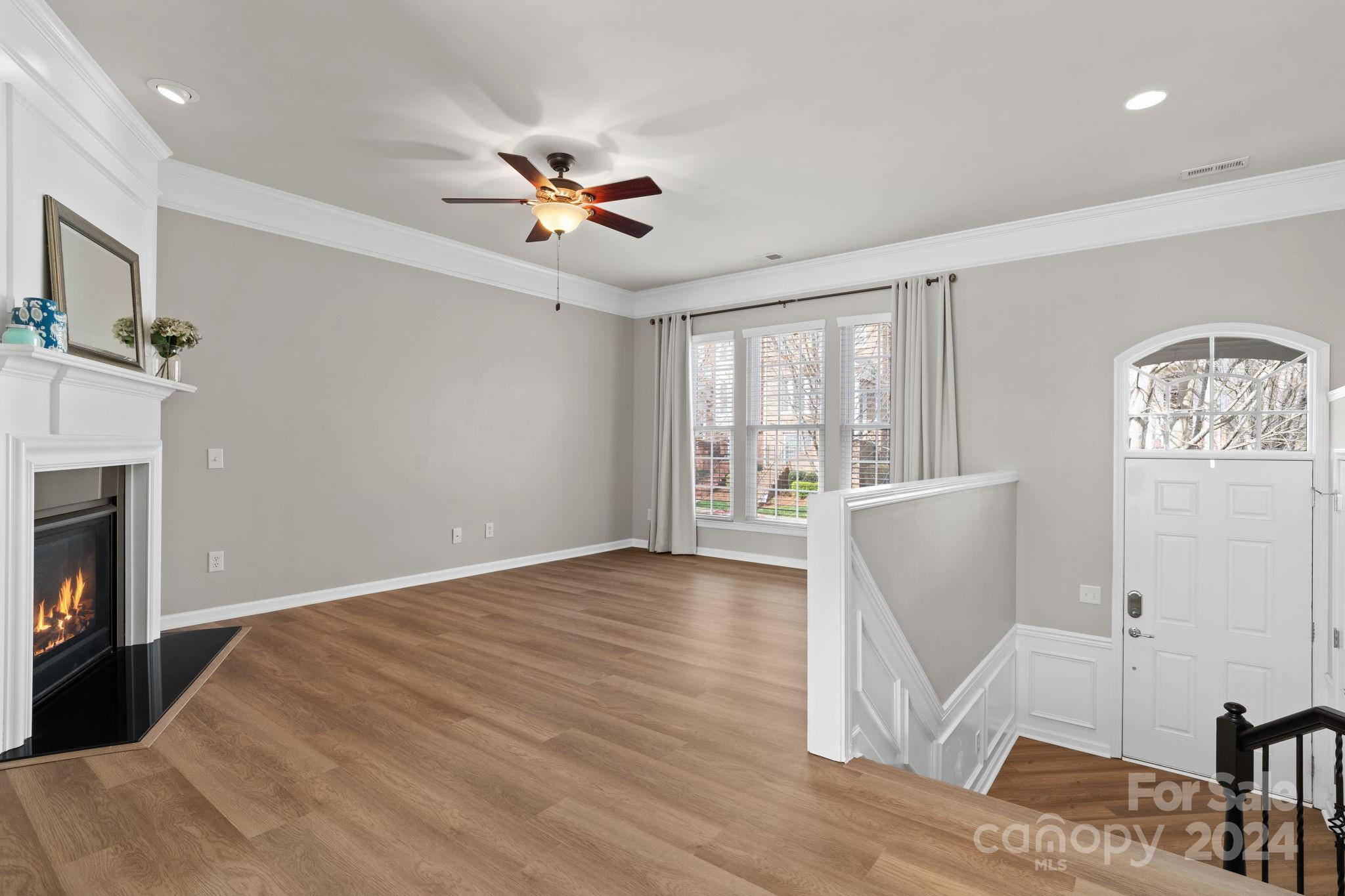 926 Lyndley Drive Fort Mill, SC 29708 - Photo 8 of 36 a view of empty room with wooden floor and fan