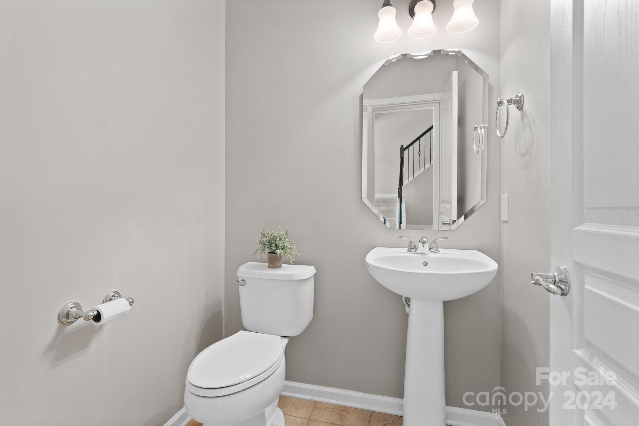 926 Lyndley Drive Fort Mill, SC 29708 - Photo 10 of 36 a bathroom with a toilet sink and mirror
