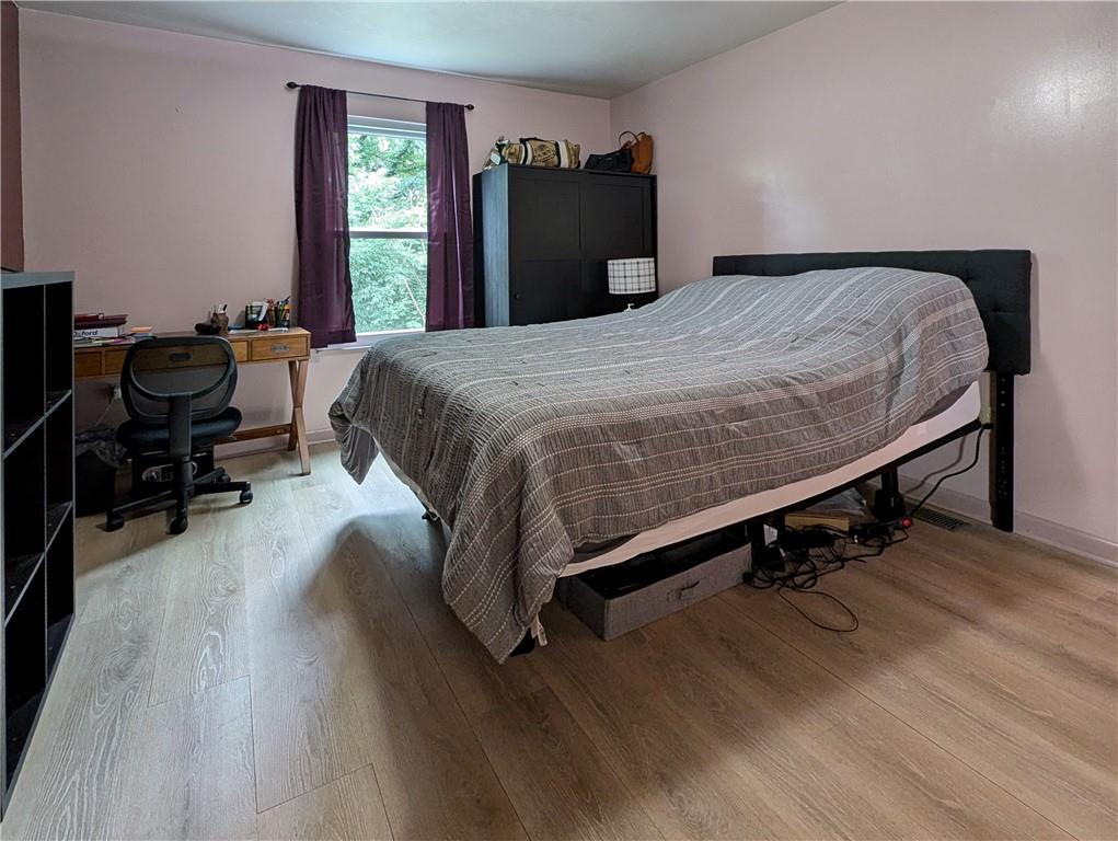 1029 Rural Ridge Drive Cheswick, PA 15024 - Photo 13 of 30 a bedroom with a bed and wooden floor