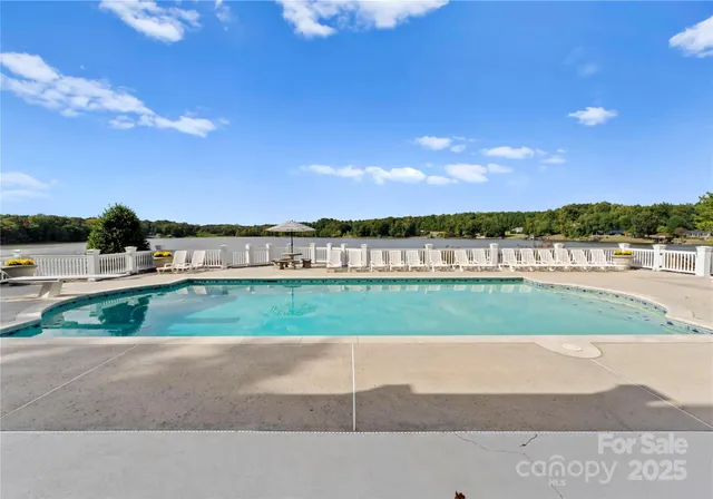 a view of a lake with a house in the background
