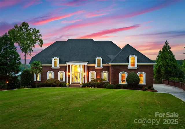 a front view of building with a garden