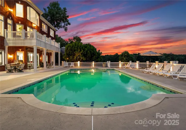 a view of a roof deck with a chair and table