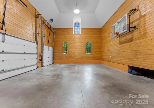 a bedroom with furniture and window
