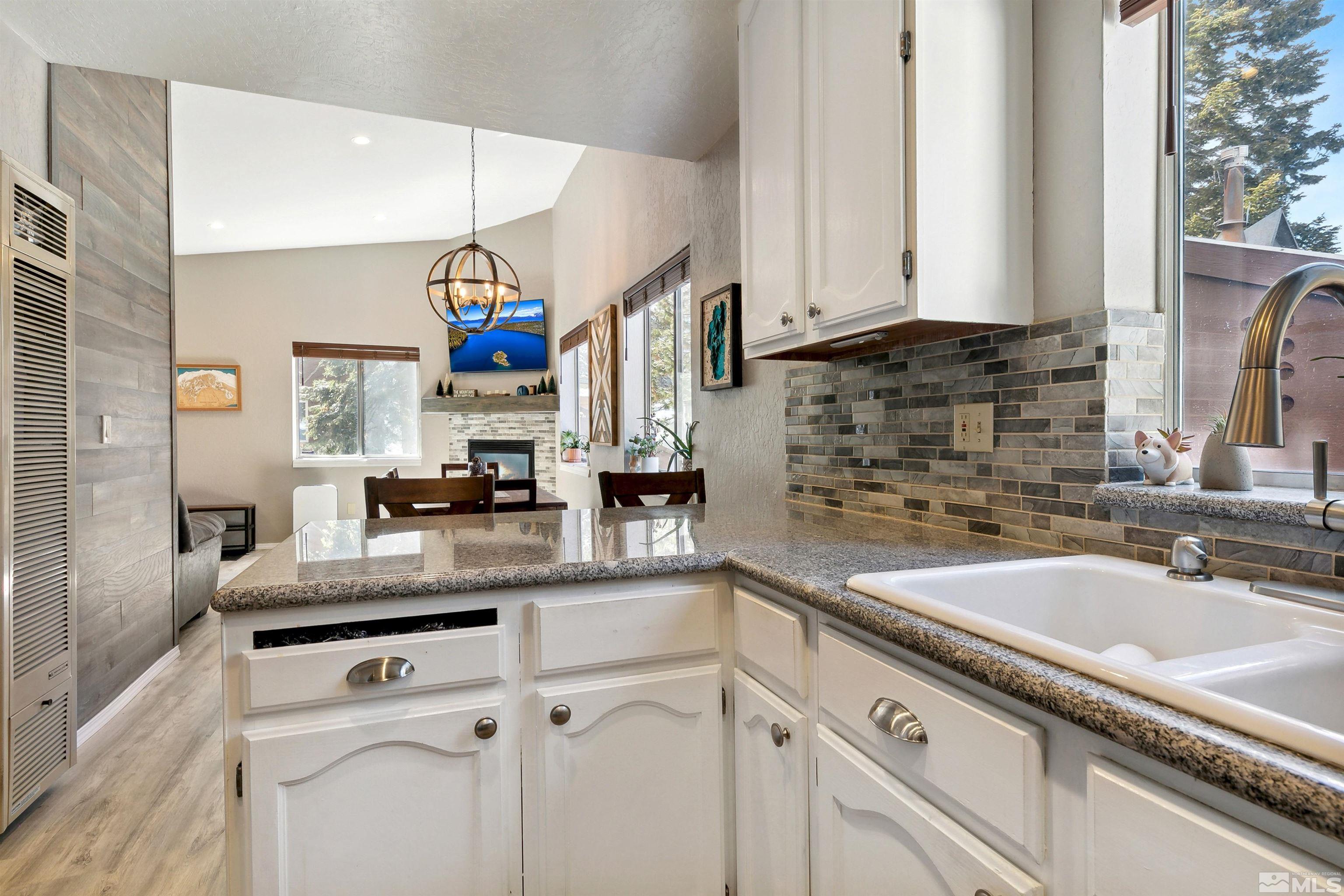 161 Tramway Drive, Unit A Stateline, NV 89449 - Photo 11 of 28 a kitchen with a sink cabinets and a window