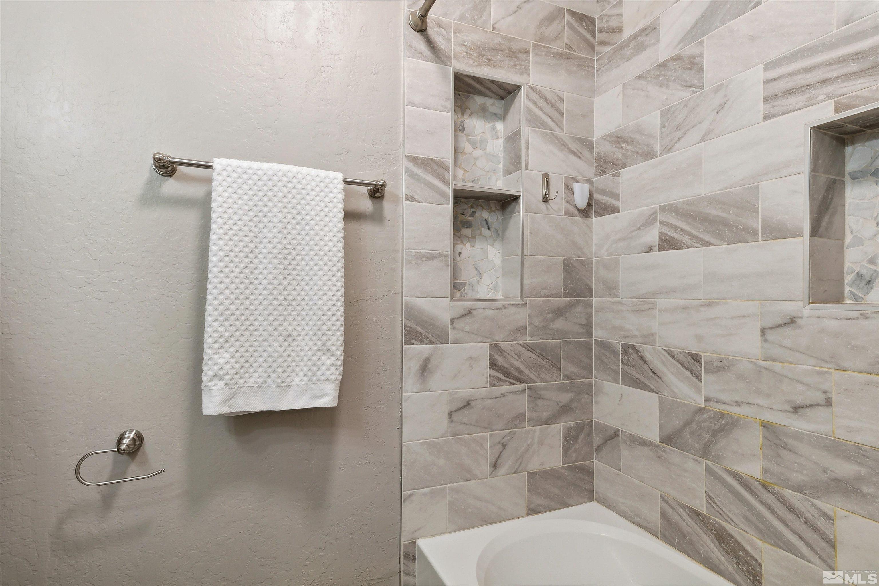161 Tramway Drive, Unit A Stateline, NV 89449 - Photo 21 of 28 a bathroom with a toilet and shower
