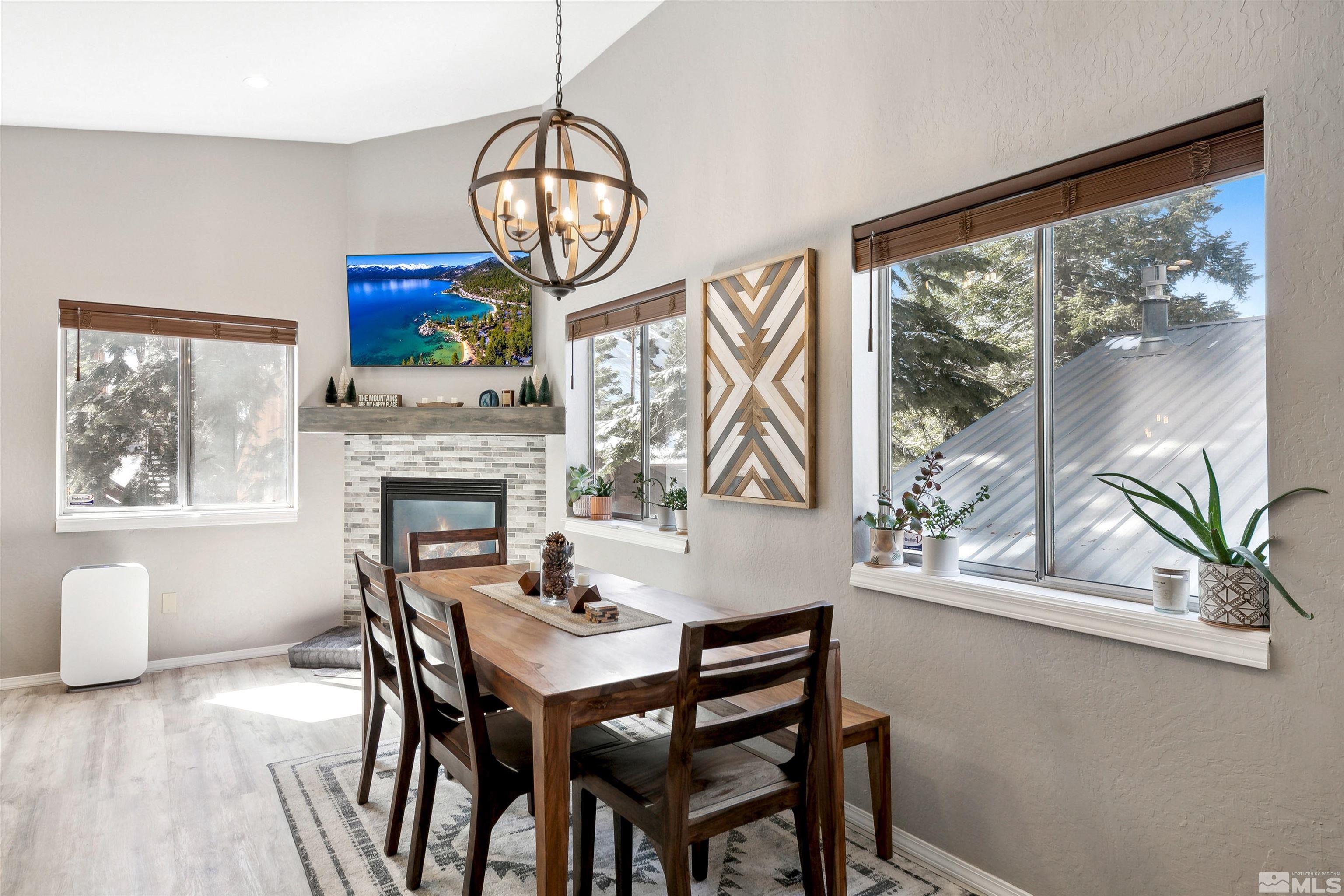 161 Tramway Drive, Unit A Stateline, NV 89449 - Photo 8 of 28 a view of a dining room with furniture window and wooden floor