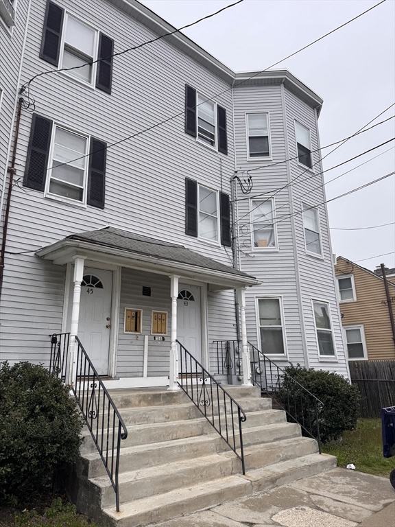 43 Sturbridge Street, Unit 3 Boston, MA 02126 - Photo 1 of 16 a front view of a house with a porch