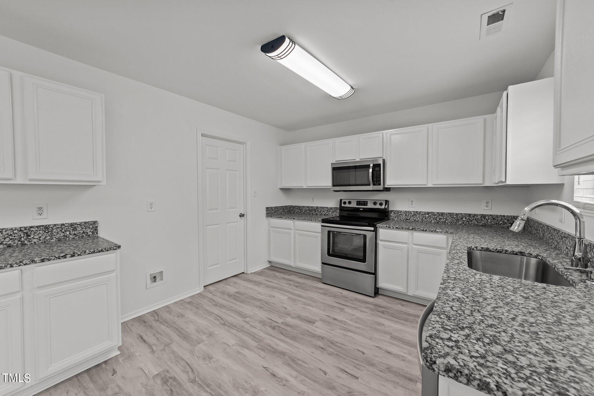5357 Thunderidge Drive Raleigh, NC 27610 - Photo 19 of 54 Door to Laundry Room