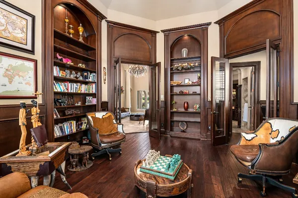 a living room with furniture and a floor to ceiling window