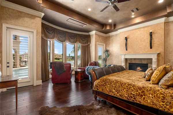 a living room with furniture fireplace and a large window