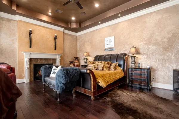 a spacious bedroom with a bed and a fireplace
