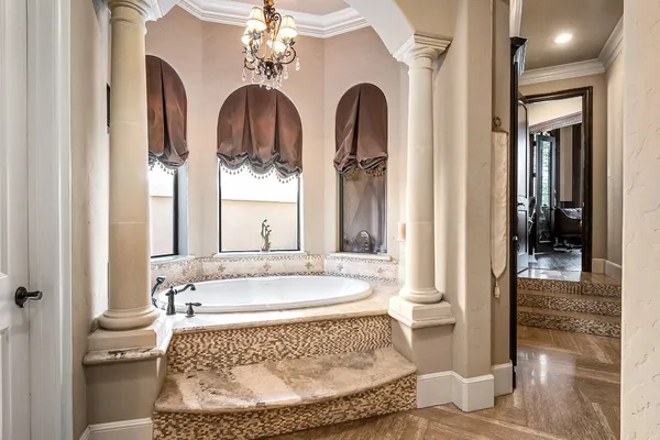 a spacious bathroom with a tub and shower