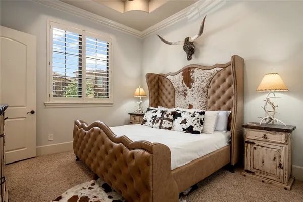 a bedroom with bed and window