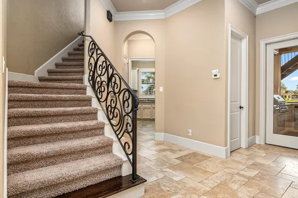 a view of entryway and hall with wooden floor