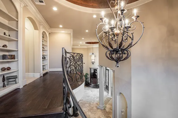 a view of a livingroom with furniture and chandelier