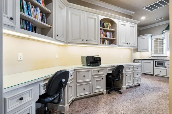 a kitchen with stainless steel appliances cabinets and a window