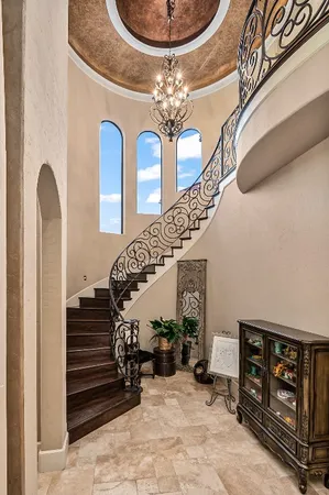a view of a entryway door with staircase