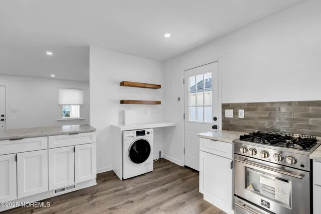 a kitchen with a stove and a sink