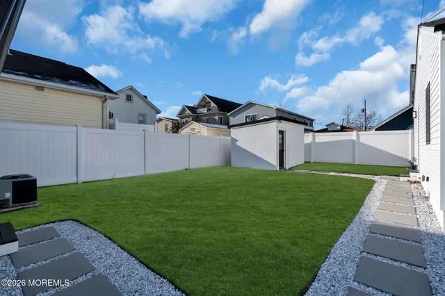 a view of a backyard with potted plants