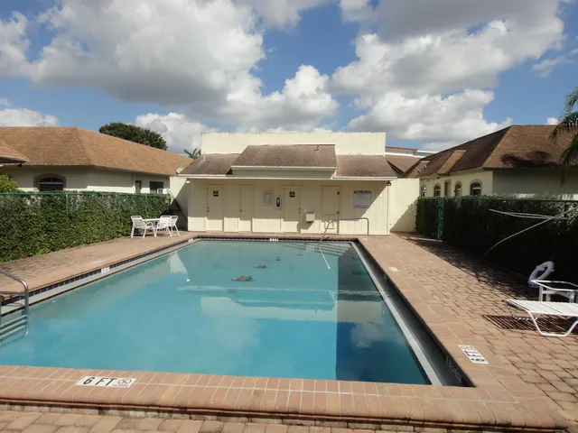 a view of a balcony with yard