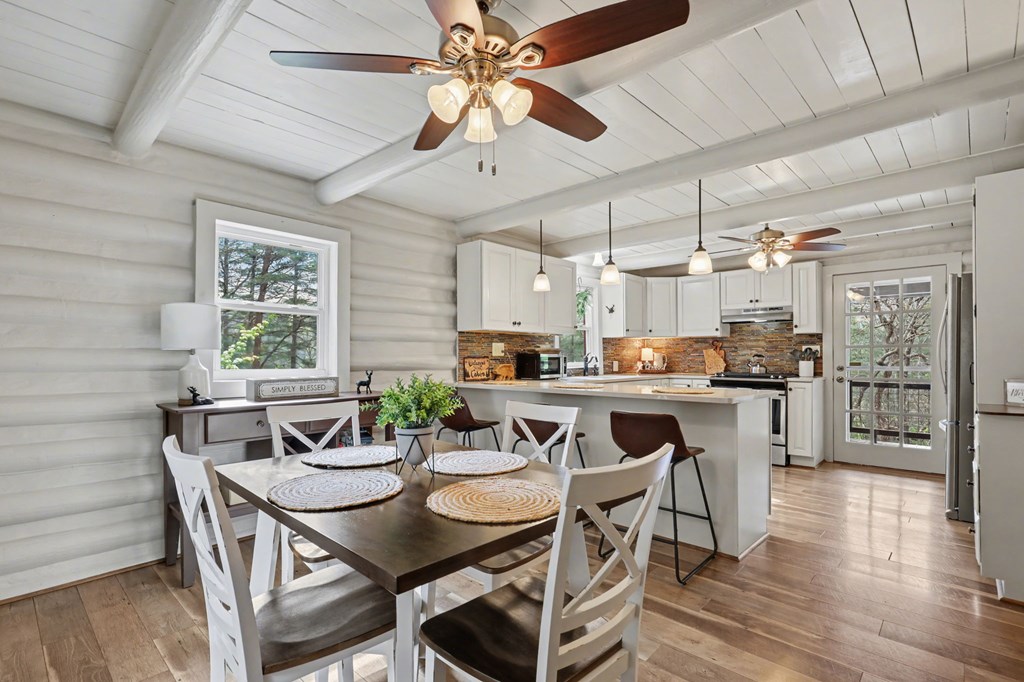 4609 Matheson Road Hiawassee, GA 30546 - Photo 11 of 57 a view of a dining room with furniture window and wooden floor