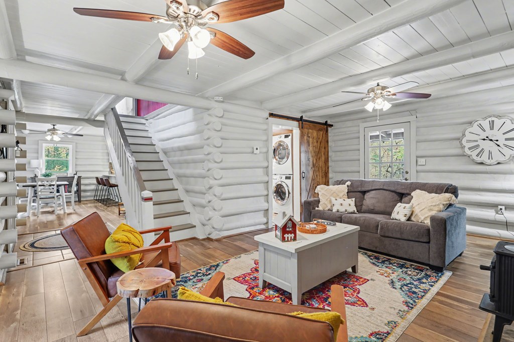 4609 Matheson Road Hiawassee, GA 30546 - Photo 23 of 57 a living room with furniture and a chandelier