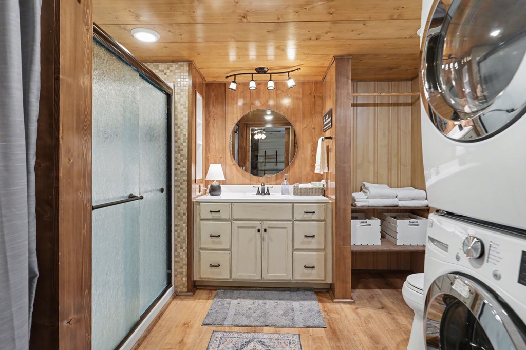 4609 Matheson Road Hiawassee, GA 30546 - Photo 29 of 57 a bathroom with a sink a mirror and a shower