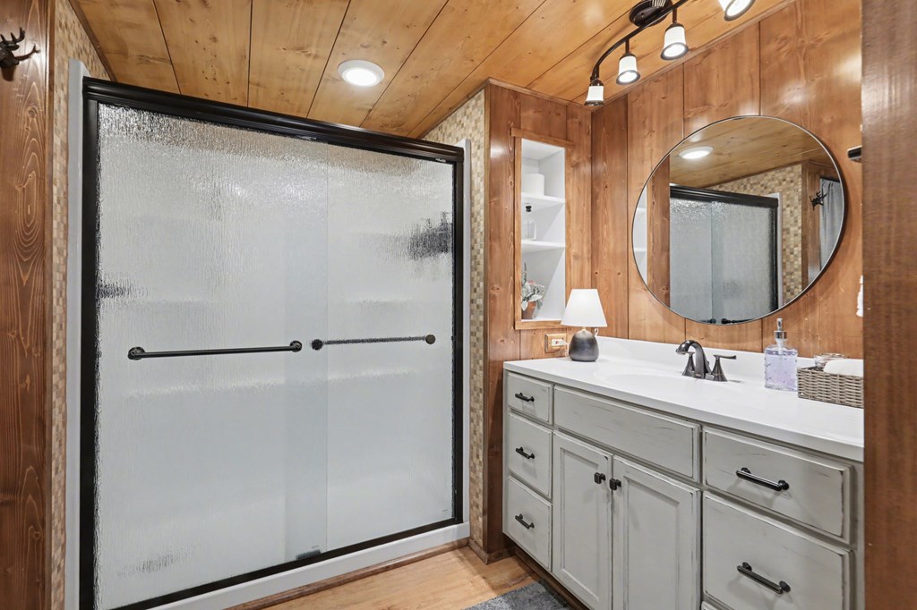 4609 Matheson Road Hiawassee, GA 30546 - Photo 30 of 57 a bathroom with a double vanity sink and mirror