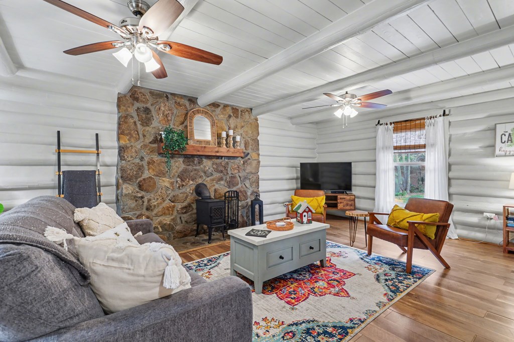 4609 Matheson Road Hiawassee, GA 30546 - Photo 31 of 57 a living room with furniture fireplace and a flat screen tv